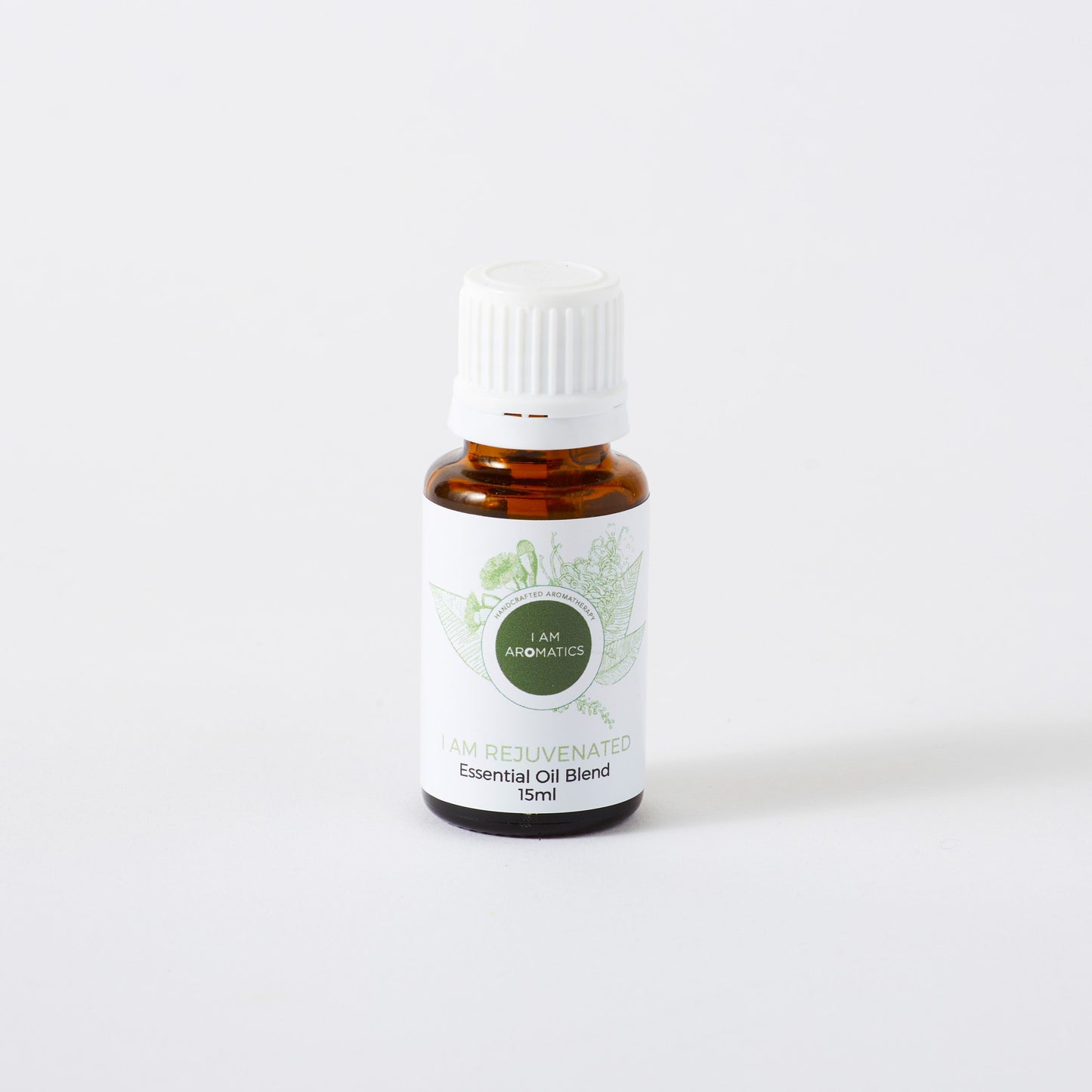 rejuvenated essential oil blend in 15ml amber bottle with white lid, white label and green botanical logo