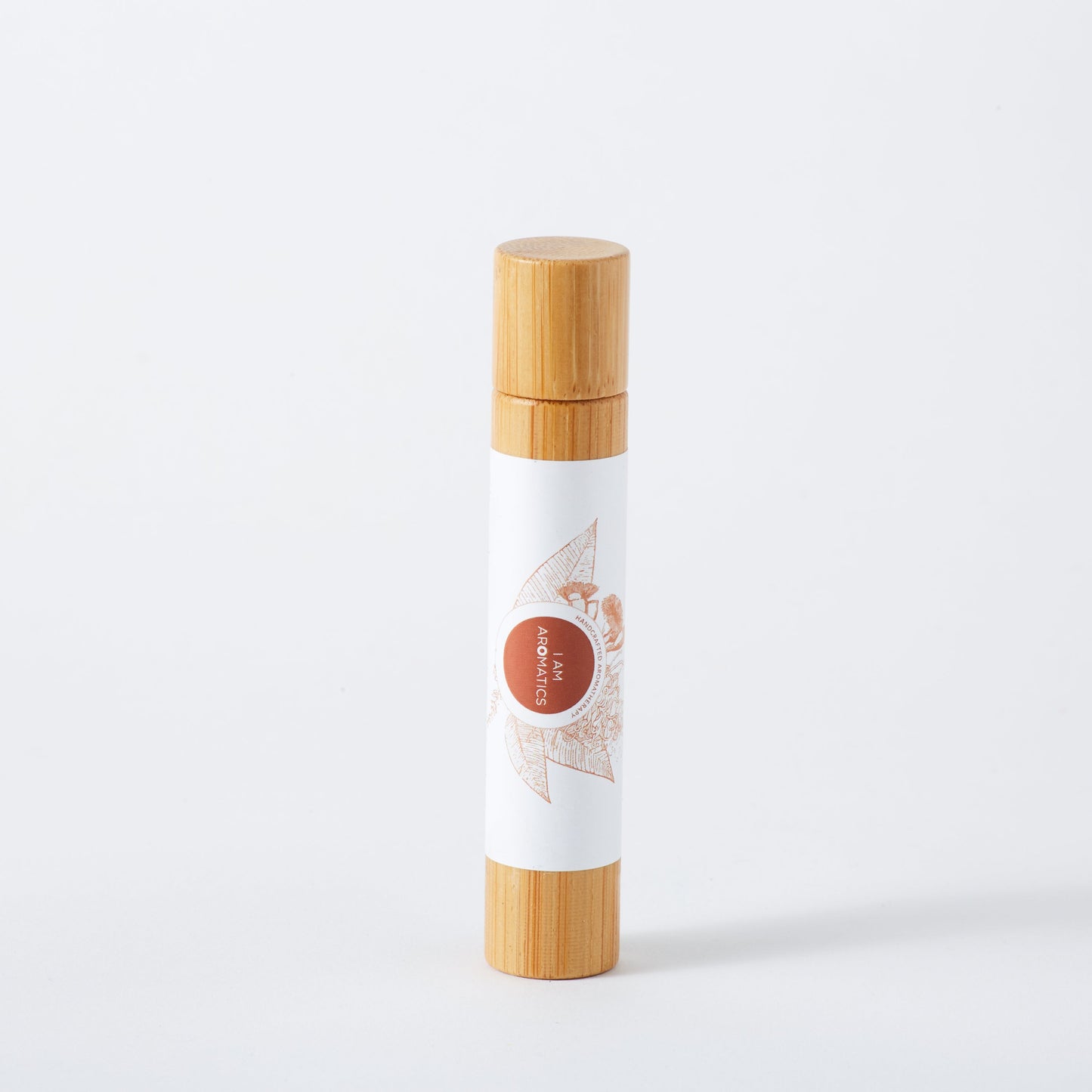 Uplift & focus natural perfume in 10ml bamboo roller bottle, white label with orange botanical logo
